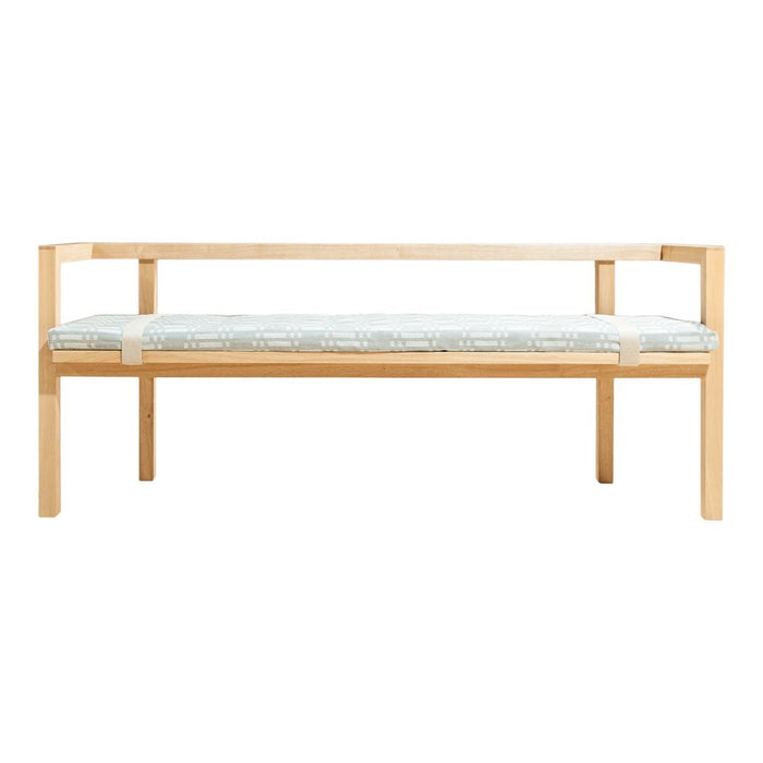 Natural wood bench with a light blue and white patterned cushion. Modern design with clean lines and minimalistic style.