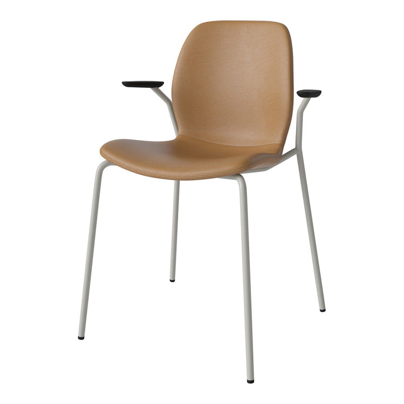 Tan chair with smooth texture and light gray legs, featuring black armrests for a modern touch.