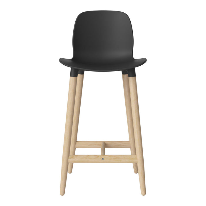 Black bar stool with a smooth, minimalist design and natural wood legs. Ideal for modern interiors.