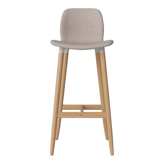 Light beige bar stool with wood legs, featuring a textured fabric seat and soft, neutral color palette.