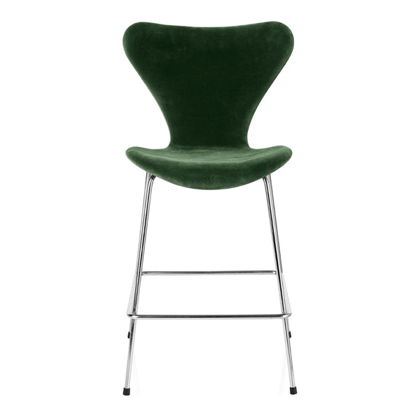Green velvet bar chair with a sleek chrome base and smooth, modern curves. Perfect for stylish seating.