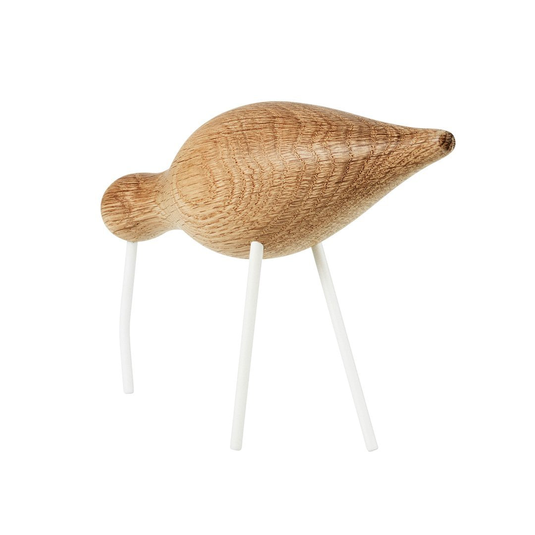 Natural wood bird figurine with a smooth, light oak finish and white legs, featuring a minimalist design.