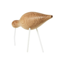 Natural wood bird figurine with a smooth, light oak finish and white legs, featuring a minimalist design.