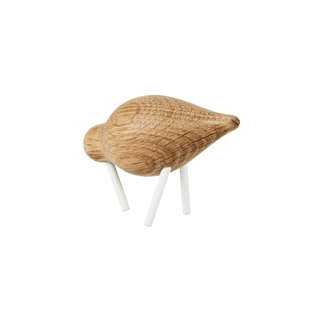 Light oak wood bird figurine with textured grain pattern and white legs, ideal for natural decor accents.