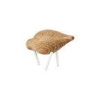 Light oak wood bird figurine with textured grain pattern and white legs, ideal for natural decor accents.