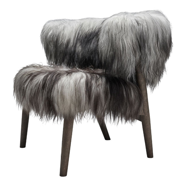 Fluffy faux fur chair in blended gray and white tones with a soft, textured pattern. Ideal for cozy decor.