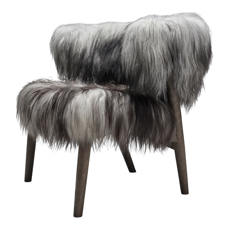 Fluffy faux fur chair in blended gray and white tones with a soft, textured pattern. Ideal for cozy decor.