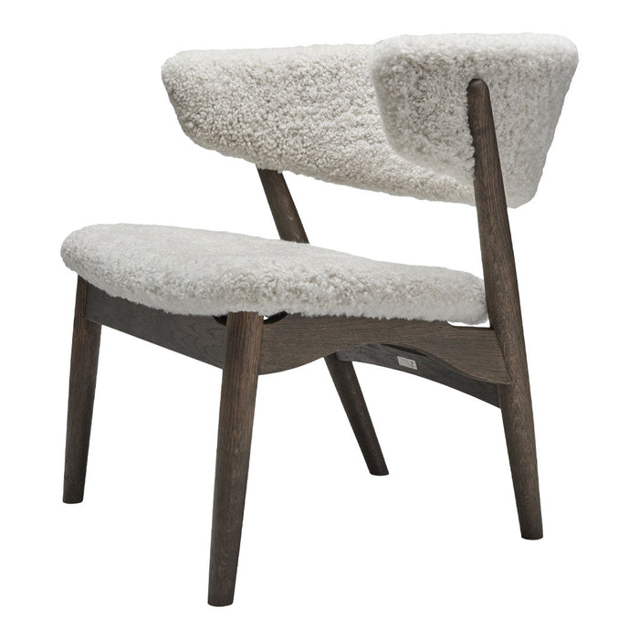 Stylish chair with soft gray upholstery and dark wooden legs, featuring a modern, minimalist design.