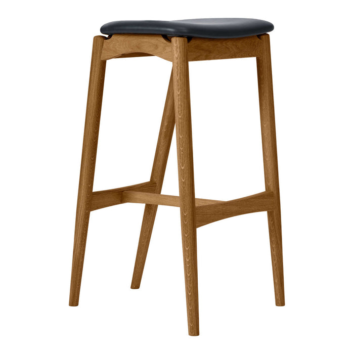 Wooden bar stool with a light natural finish and a sleek black upholstered seat. Modern, minimalist design.