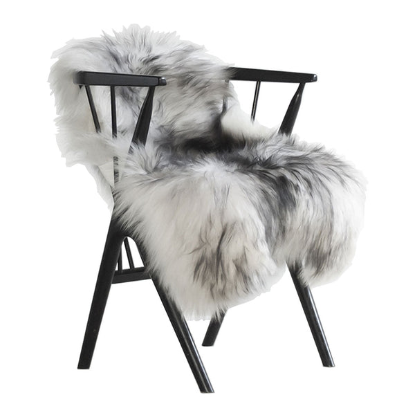 "Faux fur chair with a stylish gray and white pattern, complemented by a sleek black frame."