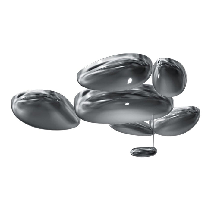 Glossy silver abstract shapes on a minimalist design, featuring smooth, reflective surfaces and organic contours.