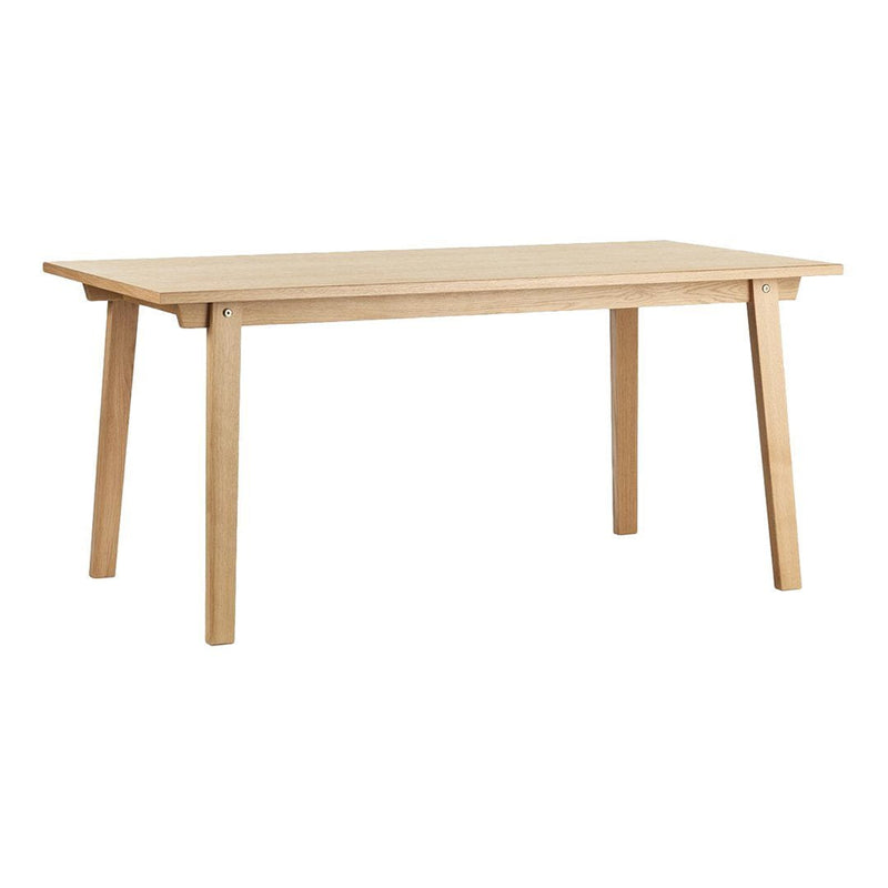 Light natural wood dining table with a smooth finish and simple, modern design. Sturdy legs support a rectangular top.