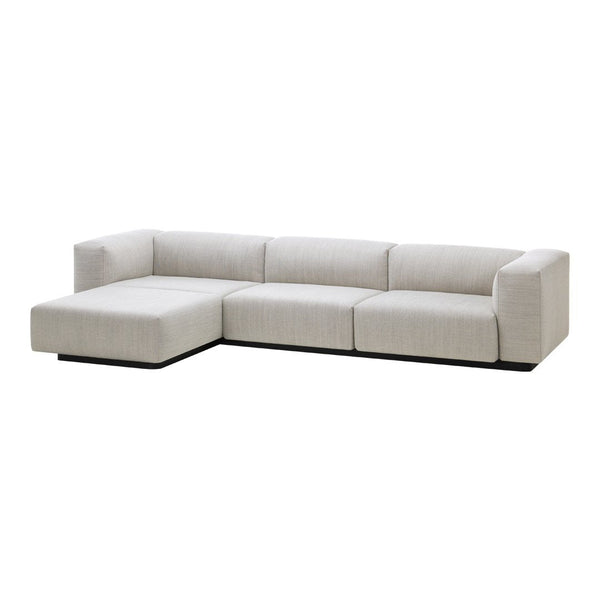 Light gray sectional sofa with a sleek, minimalist design and subtle fabric texture, perfect for modern decor.