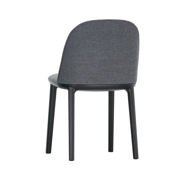 Gray upholstered chair with a smooth, minimalist design and black wooden legs, offering modern elegance.