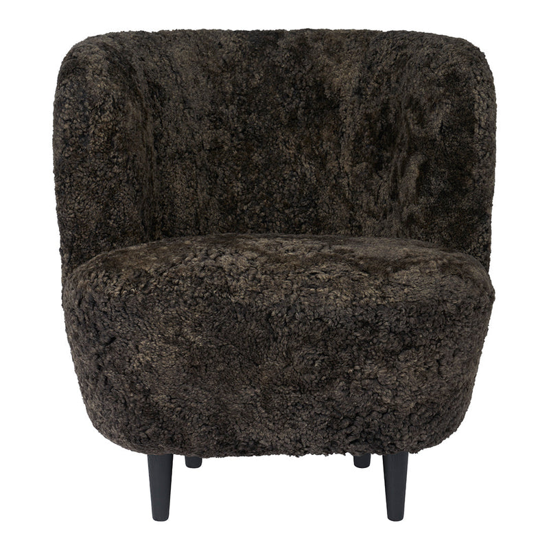 Brown textured accent chair with a soft, shaggy pattern and black legs. Ideal for cozy, modern decor.