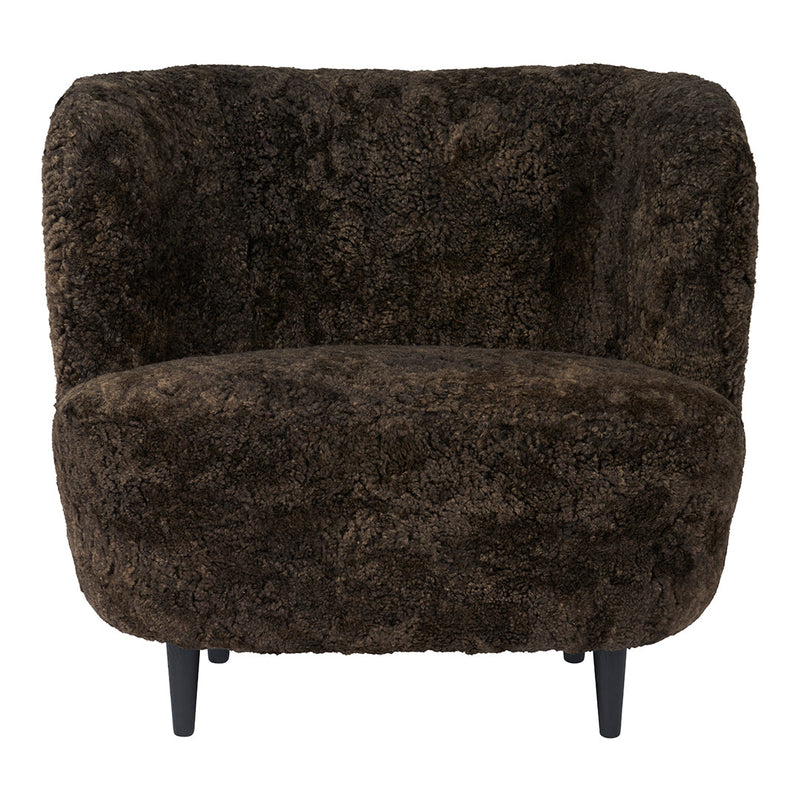 Cozy brown faux fur armchair with soft, textured pattern and sleek black legs, ideal for warm, stylish decor.