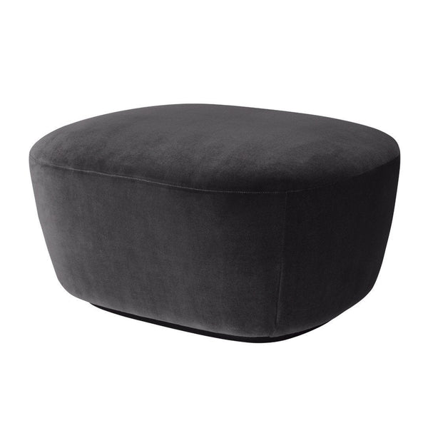 Black upholstered ottoman with a smooth, rounded shape and soft, velvety texture, perfect for modern decor.