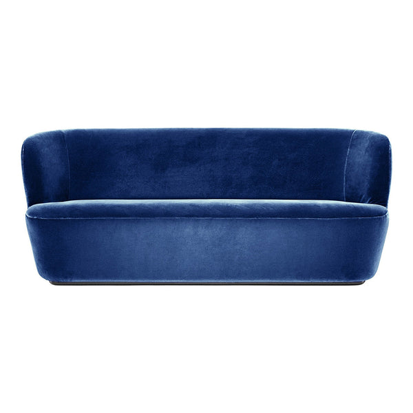Elegant deep blue velvet sofa with a sleek, modern design and smooth, rich texture. Perfect for contemporary decor.