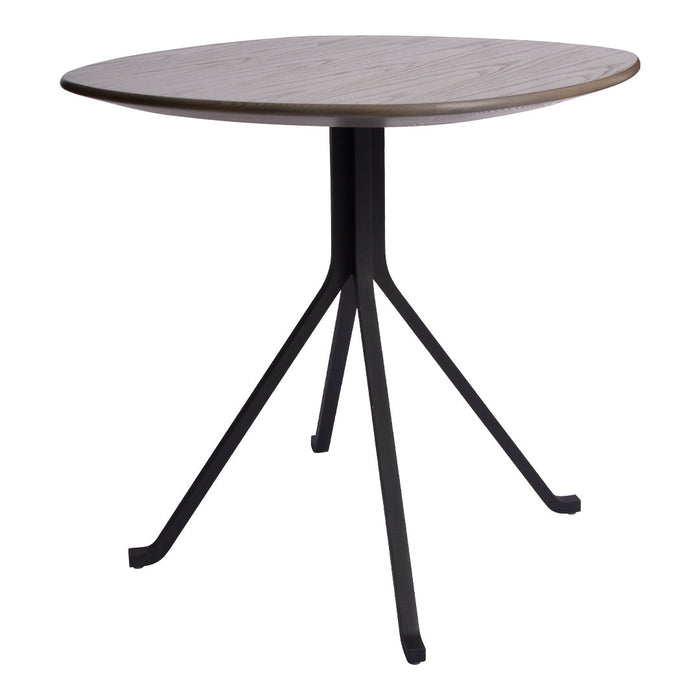 Round wooden table with a light gray finish and a black metal tripod base, showcasing a minimalist design.