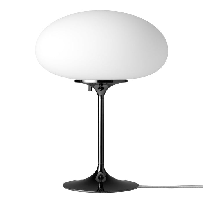 White frosted glass lamp with a sleek black base, featuring a minimalist design and smooth, rounded shapes.