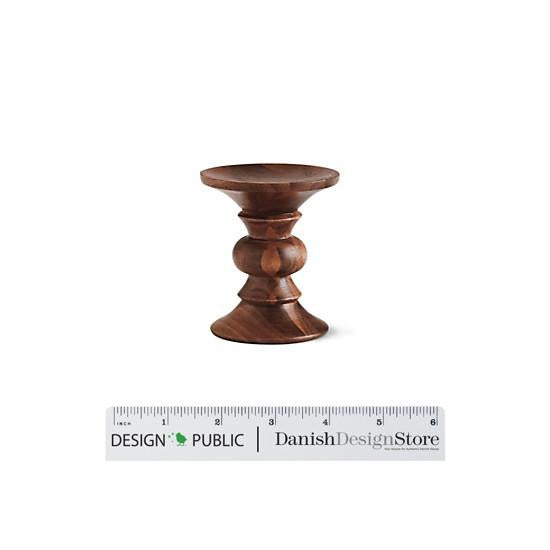 Elegant wooden candlestick holder in rich brown tones with a smooth, polished finish and classic, fluted design.