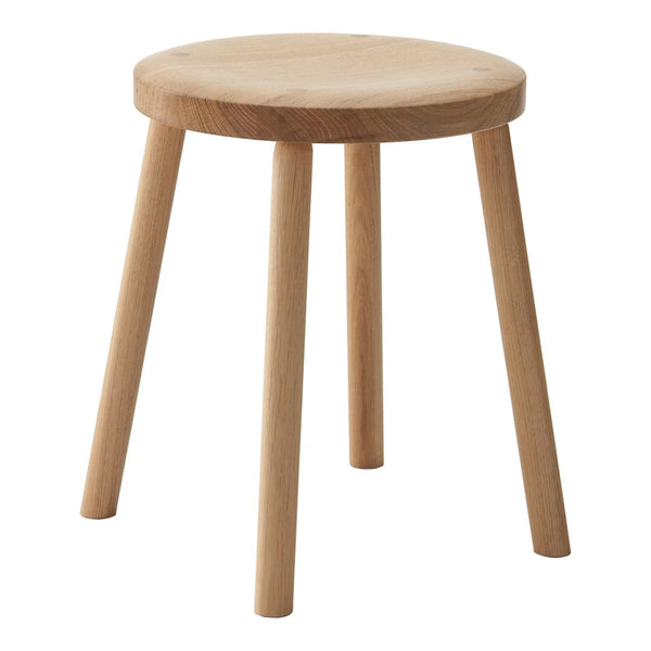 Natural wood stool with a smooth, round top and tapered legs, showcasing a minimalist design and light beige hue.