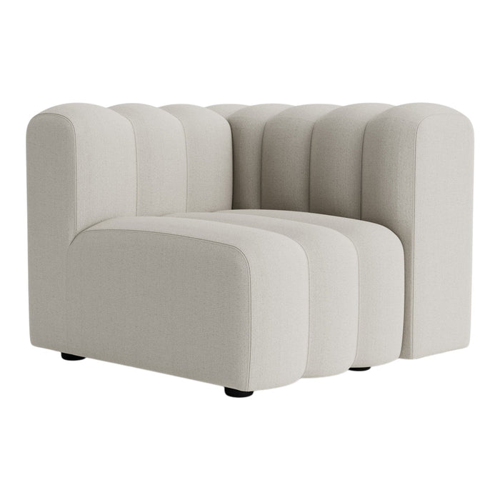 Cream-colored sofa with a ribbed design and rounded edges, perfect for modern living spaces.