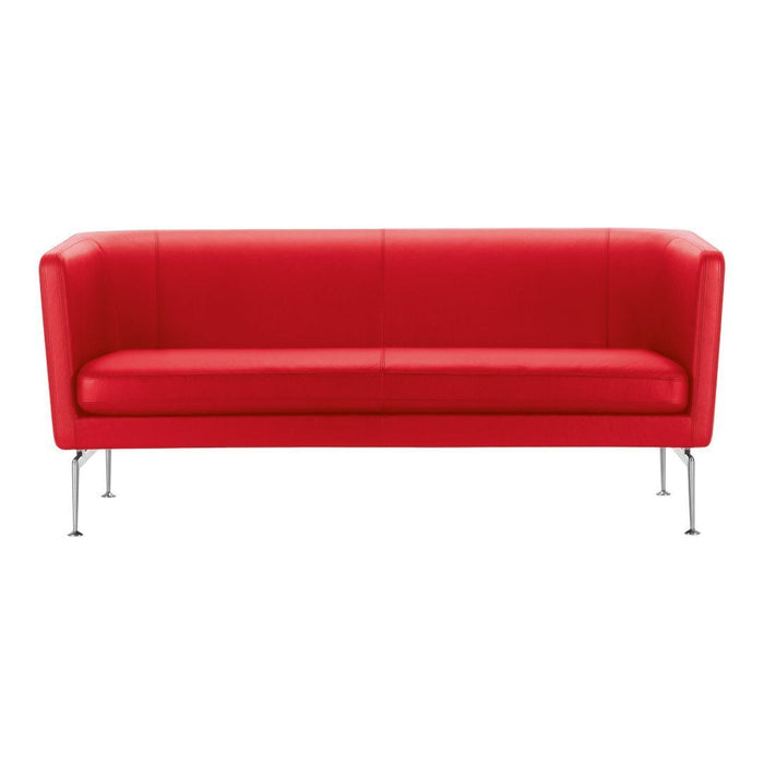 Bold red leather sofa with clean lines and sleek chrome legs, perfect for modern interiors.