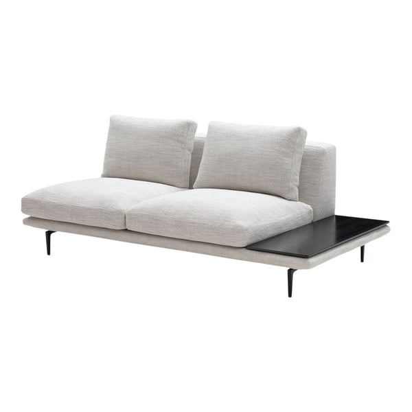 Light gray upholstered sofa with subtle texture and sleek black side table, featuring minimalist design.