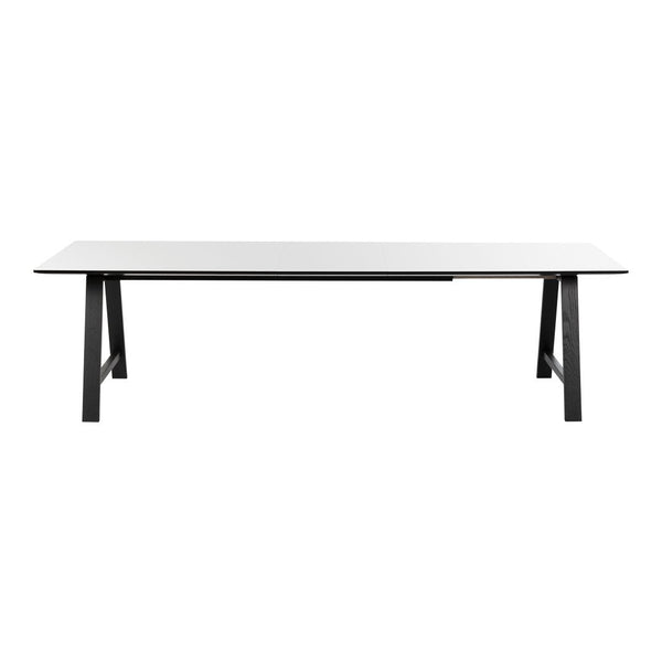 Modern white tabletop with sleek black legs, featuring a minimalist design and smooth finish. Perfect for contemporary decor.