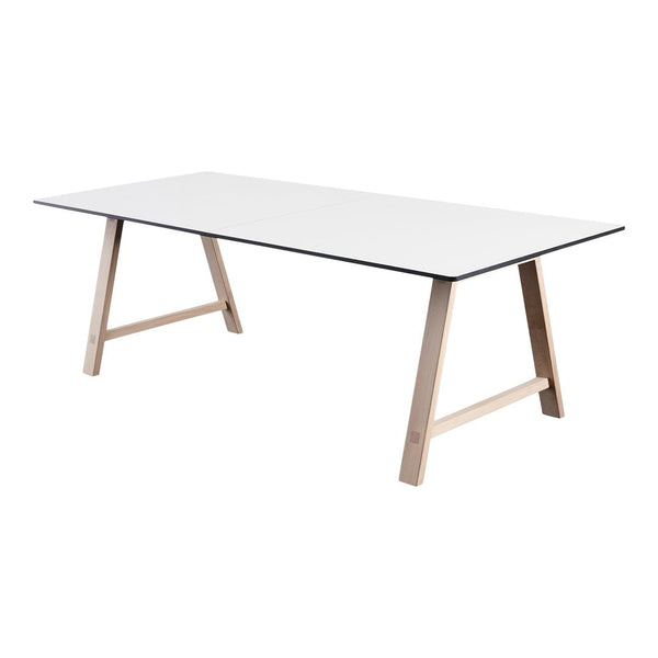 Modern white table with sleek black edges and natural wood legs, perfect for minimalist decor.