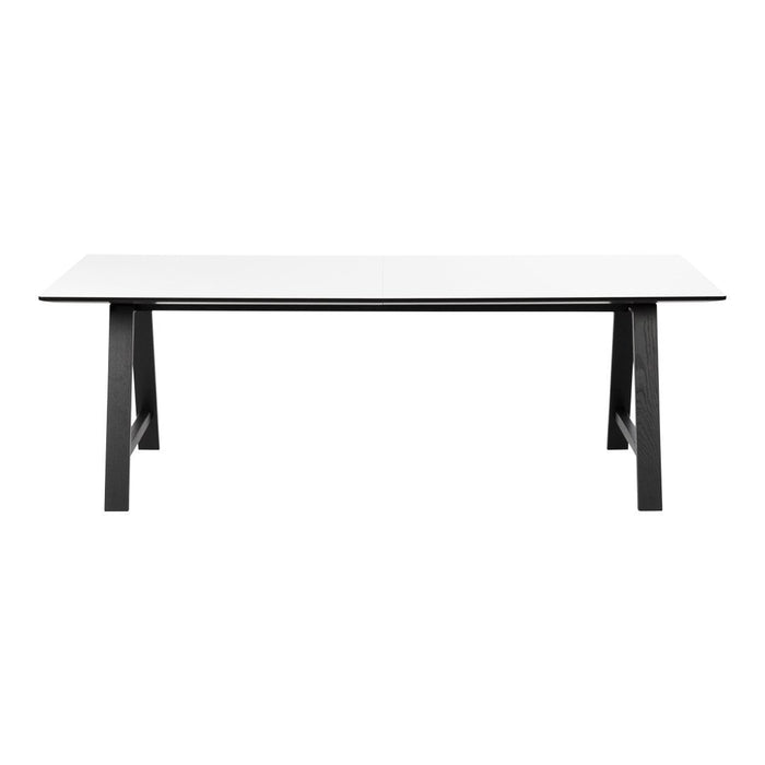 Modern white tabletop with sleek black legs, featuring a minimalist design and clean lines for any dining space.