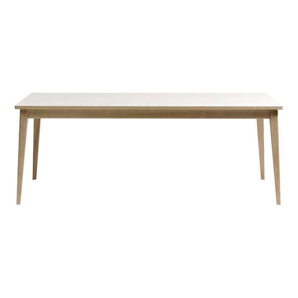 Light-colored wooden dining table with a smooth surface and tapered legs, showcasing a minimalist design.