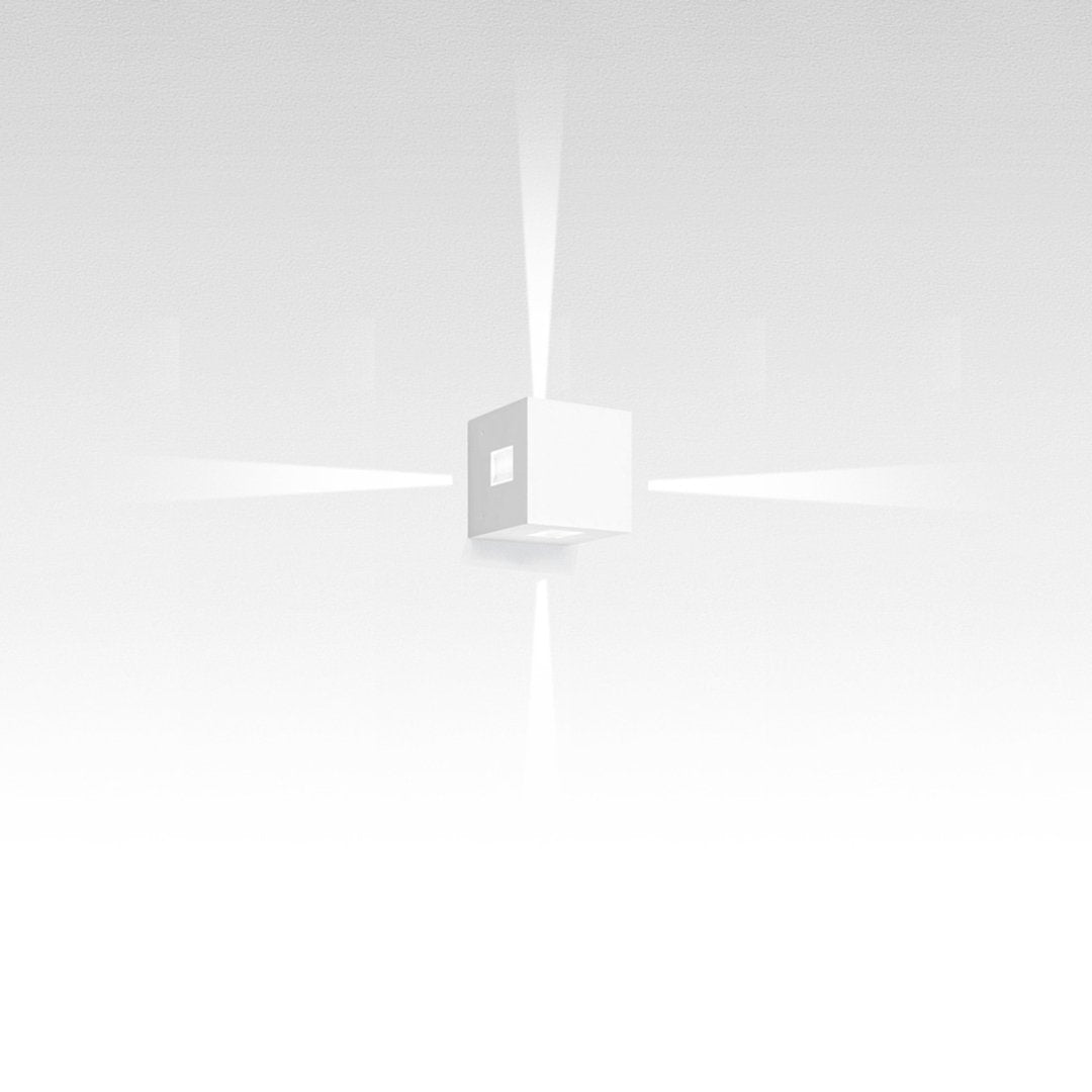 White minimalist cube with soft light rays, blending seamlessly into a clean, white background. Ideal for modern decor.