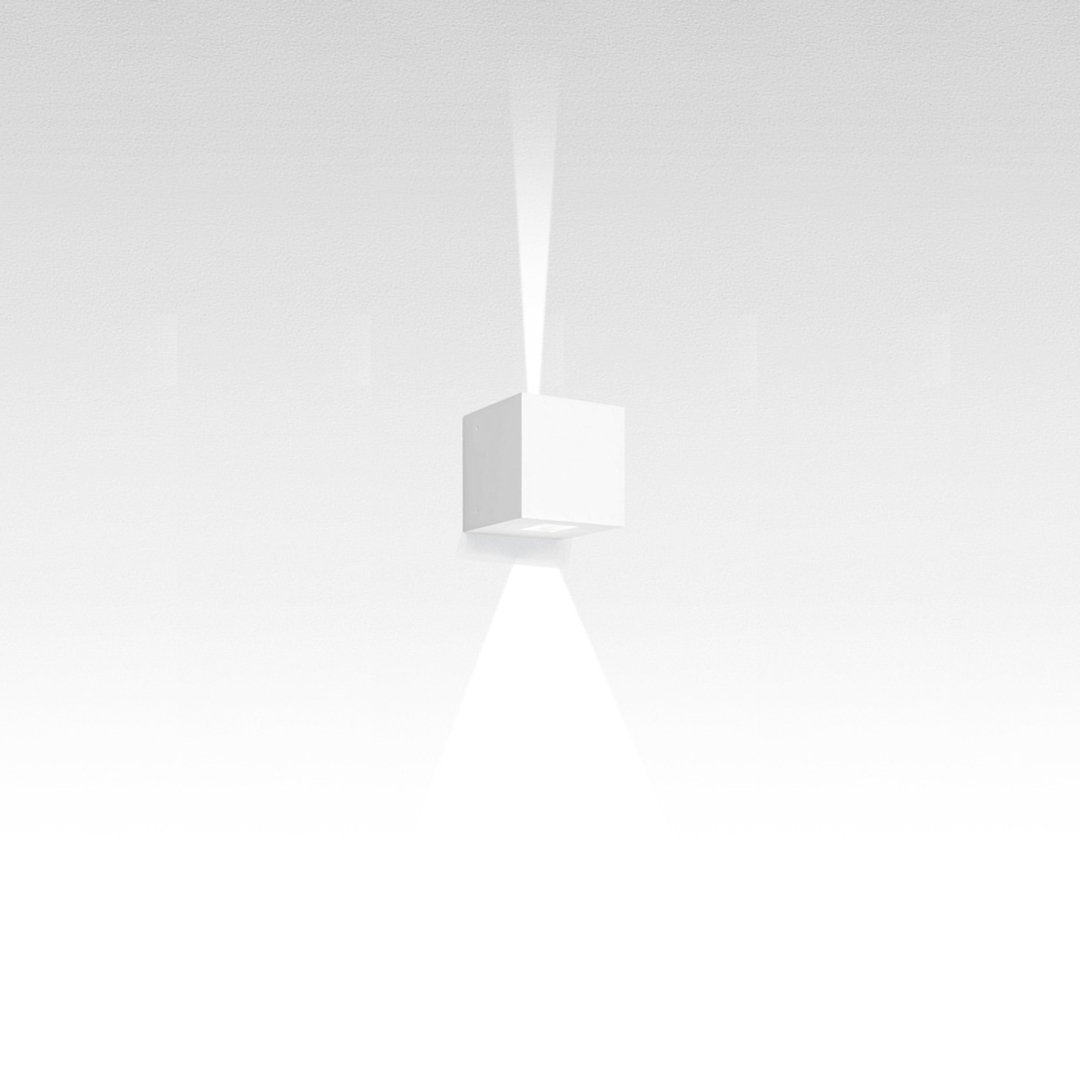 Minimalist white cube pendant light casting a soft, focused beam, blending seamlessly with a gradient background.