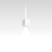 Minimalist white cube pendant light casting a soft, focused beam, blending seamlessly with a gradient background.