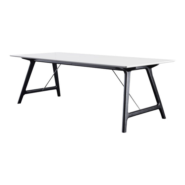 Modern rectangular table with a sleek white top and black legs, featuring a minimalist design. Perfect for contemporary spaces.