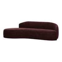 Burgundy velvet modern sofa with smooth curves and a minimalist design. Elegant and contemporary home accent.