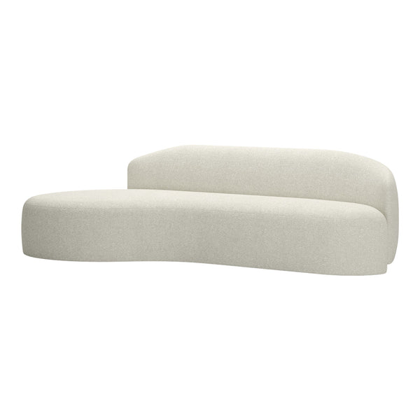 Curved sofa in soft cream fabric with a textured pattern, ideal for modern interiors.