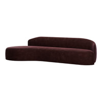 Curved burgundy sofa with a smooth, textured upholstery, creating a modern and stylish look.