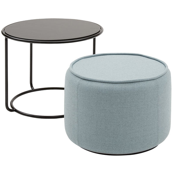 Black round side table and light blue upholstered ottoman with a smooth, textured finish.
