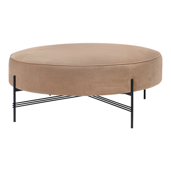Round beige velvet ottoman with a sleek black metal base, featuring a smooth texture and modern design.