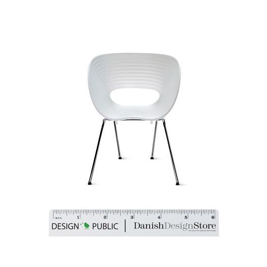 White ribbed chair with a sleek modern design and chrome legs, showcasing a stylish and minimalist aesthetic.