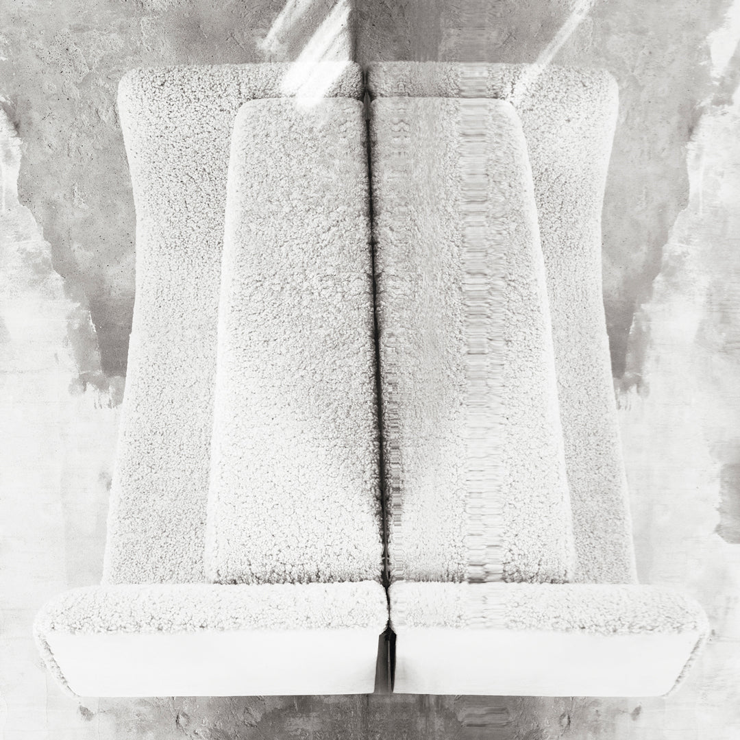 Textured white upholstery with subtle patterns, offering a modern and minimalist aesthetic. Perfect for contemporary decor.