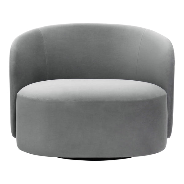 Round gray accent chair in soft velvet. Smooth, modern design with subtle curves and a sleek finish. Perfect for any space.