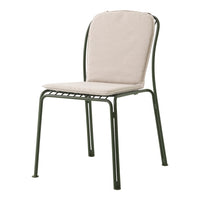 Beige cushion on a green metal chair, featuring a simple, modern design with clean lines and a minimalist aesthetic.