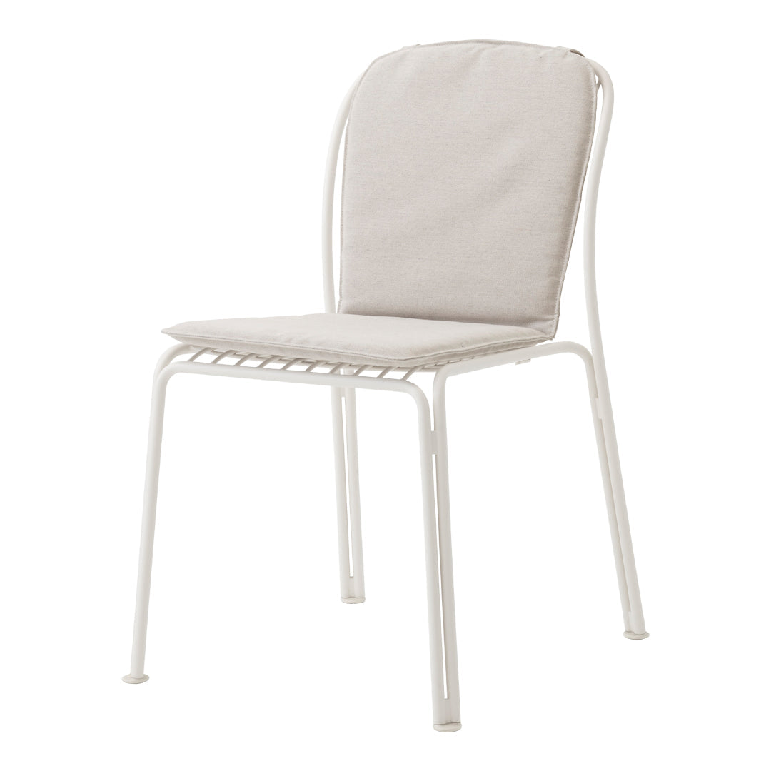 Light beige upholstered chair with a sleek white metal frame, combining minimalism and modern design.
