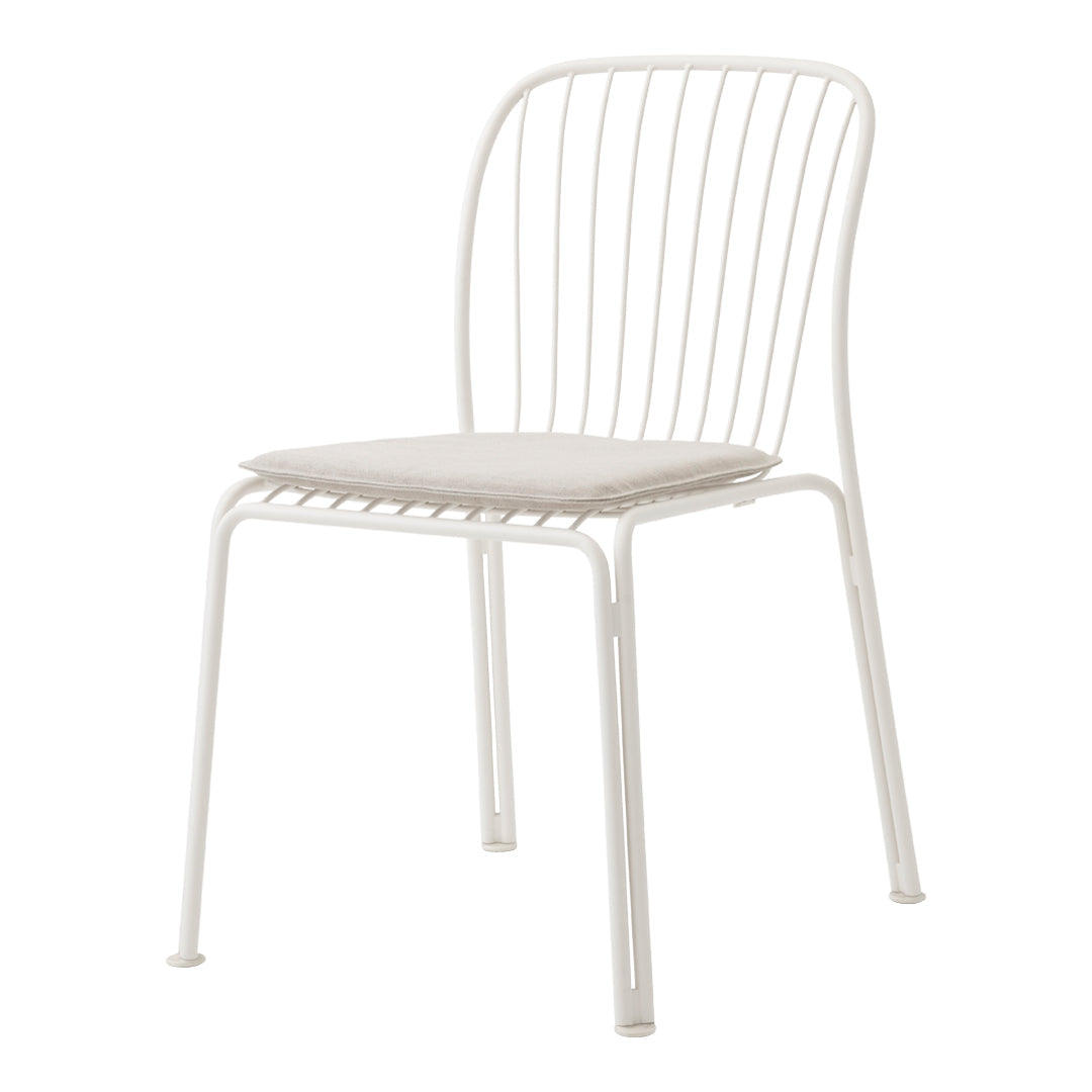 White metal chair with a minimalist design, featuring a slatted backrest and a soft beige seat cushion.