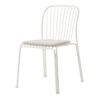 White metal chair with a minimalist design, featuring a slatted backrest and a soft beige seat cushion.