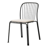Black metal chair with sleek wire design and cream cushion seat, perfect for modern decor.